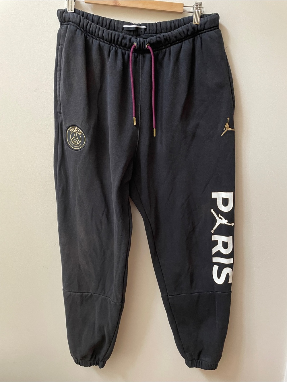 Jordan x Paris Saint-Germain Black Joggers with Gold Logos and White PARIS